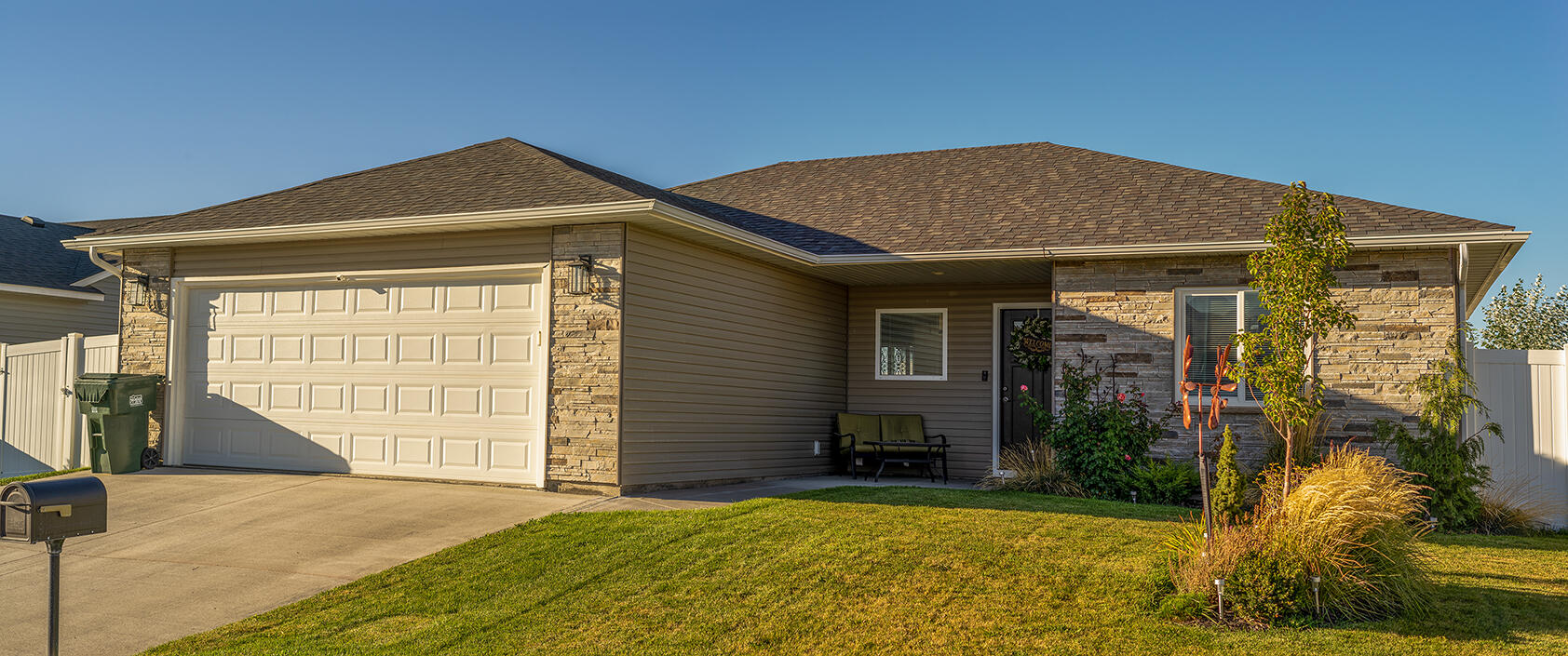 Small beige house with lawn Small beige house with lawn