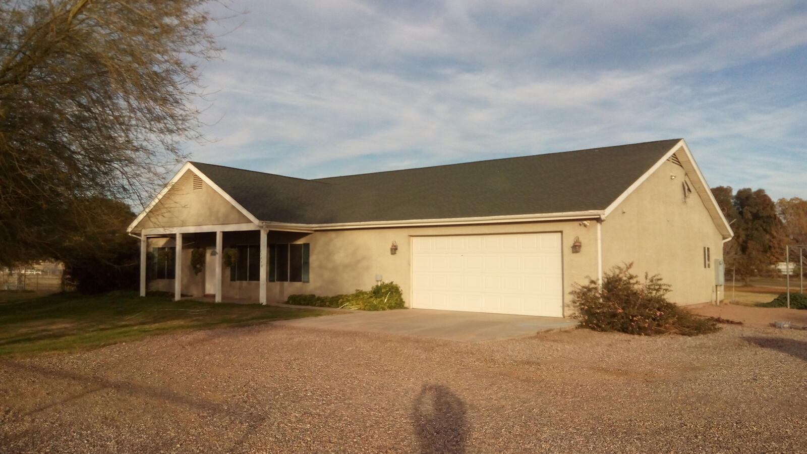 Beige house with dark roof Beige house with dark roof